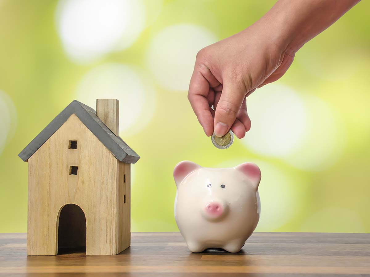 Putting money in a piggy bank